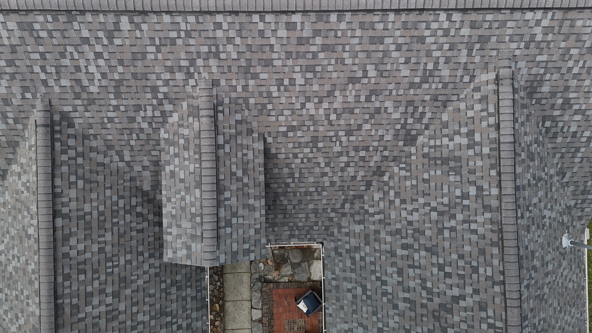 Close-up of designer architectural shingles on a completed Ballantyne, NC roof — premium material installation