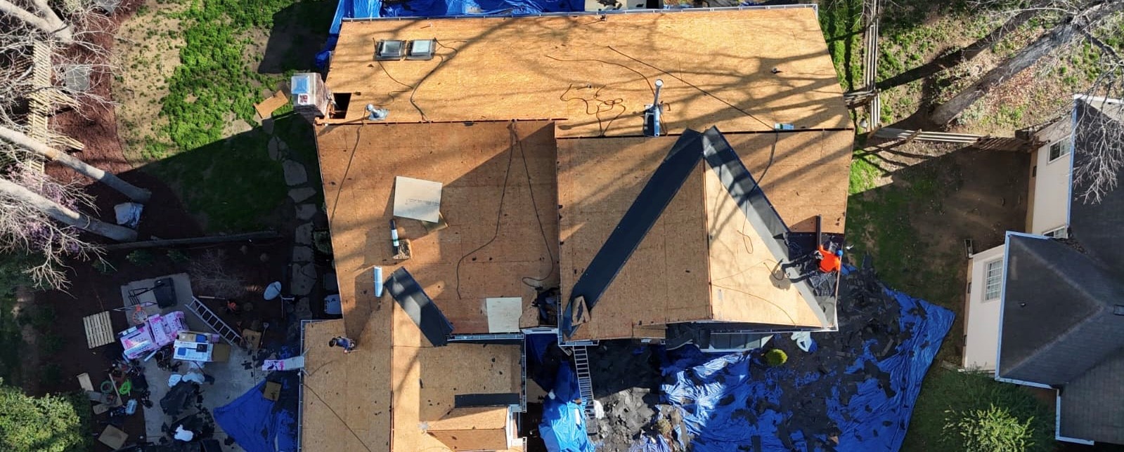 Roof installation in progress in Monroe, NC — synthetic underlayment installed before shingle layer by Charlotte Ace Roofing