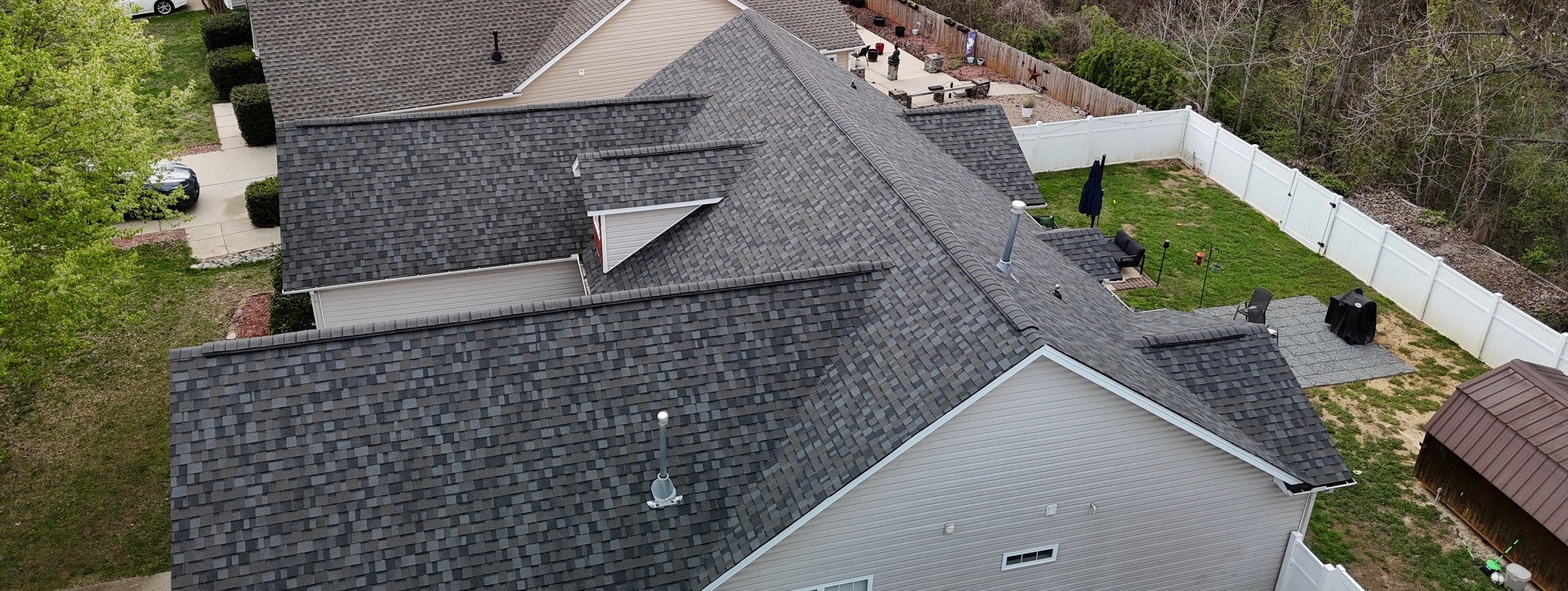 Aerial view of a completed multi-gable architectural shingle roof replacement on a Mooresville, NC home by Charlotte Ace Roofing