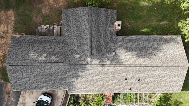 Aerial top-down view of a completed architectural shingle roof replacement on a Pineville, NC home by Charlotte Ace Roofing