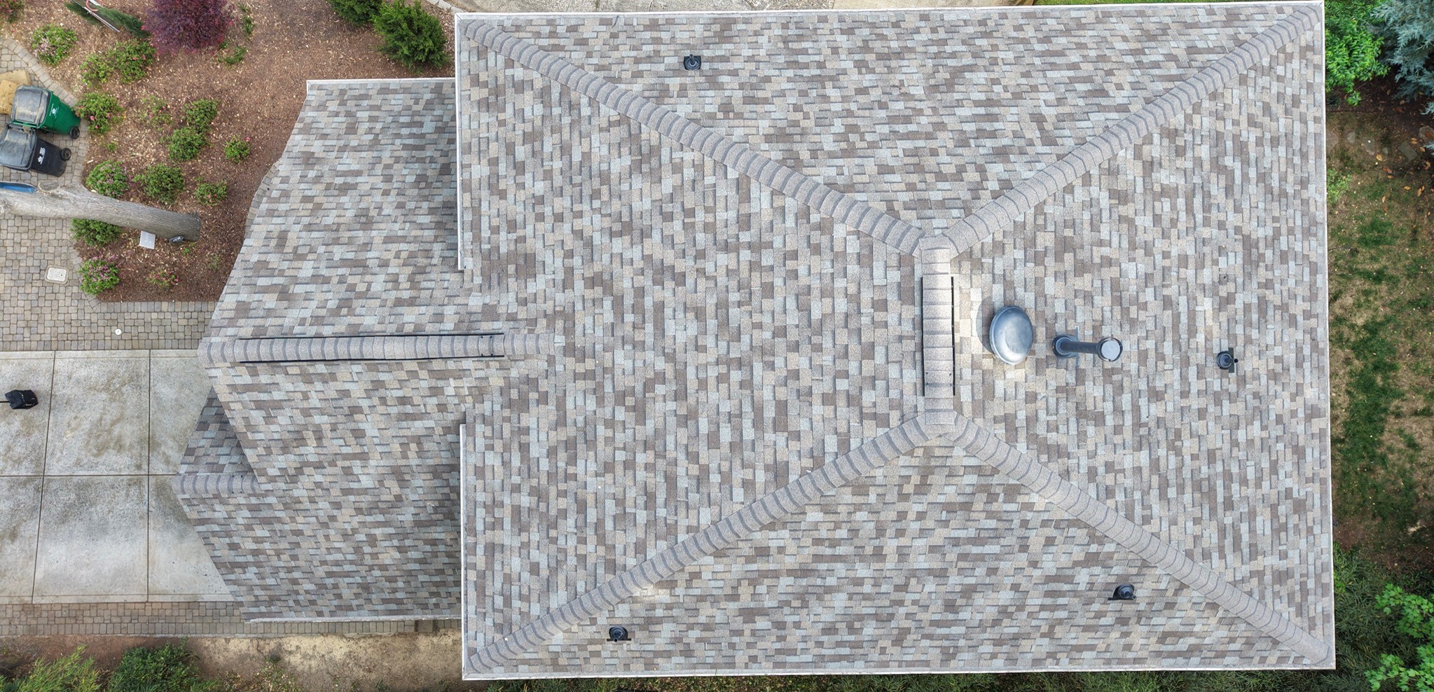 Aerial view of a completed designer architectural shingle roof replacement on a SouthPark Charlotte home — multi-tone gray and tan blend by Charlotte Ace Roofing