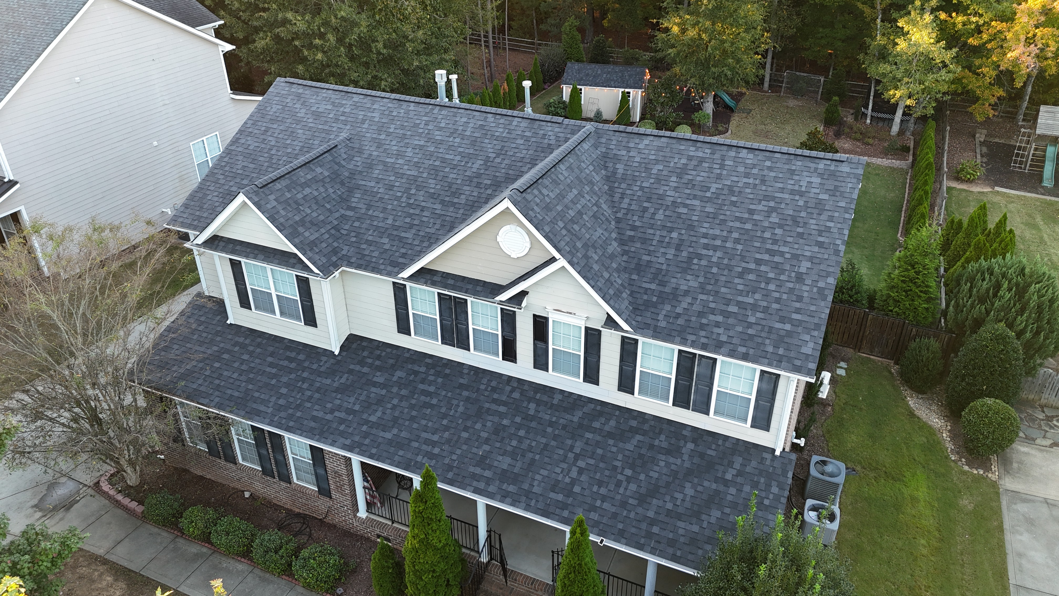 Completed architectural shingle roof on a two-story home in a Waxhaw, NC subdivision — installed by Charlotte Ace Roofing